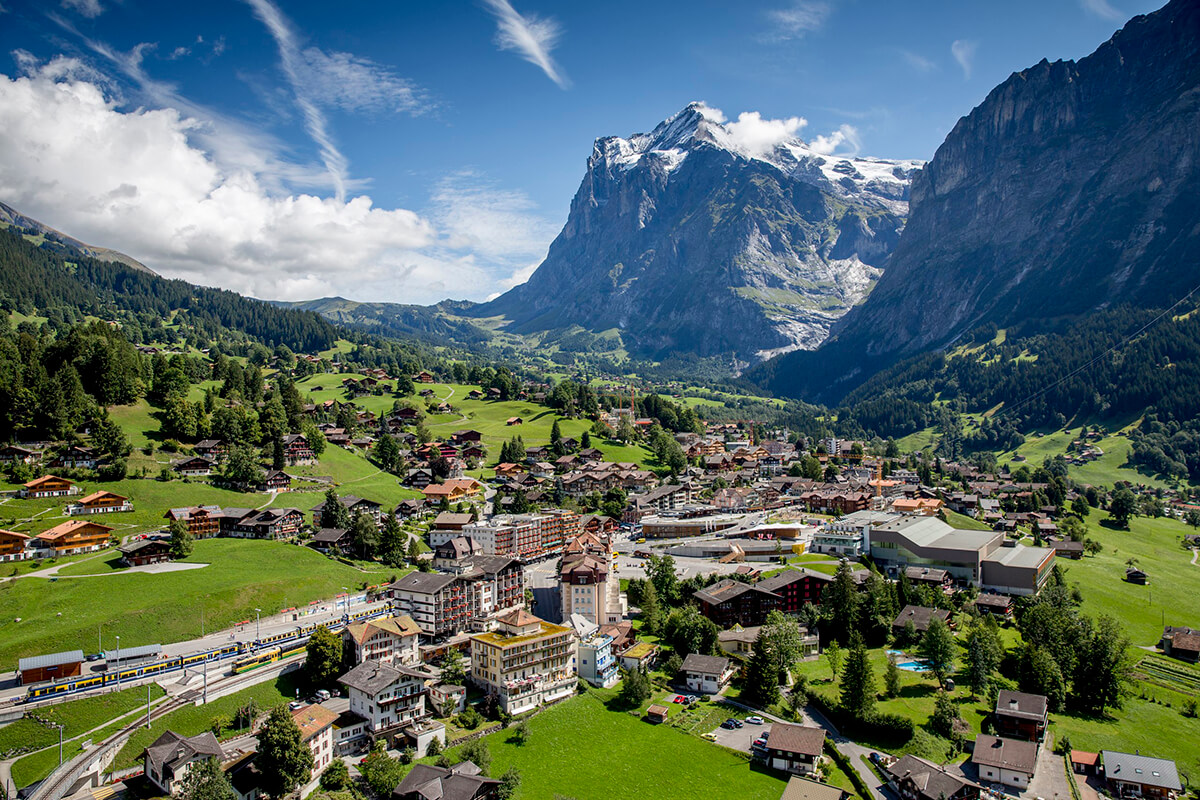 Grindelwald is a beautiful town in Switzerland. The picture shows popular train station and town